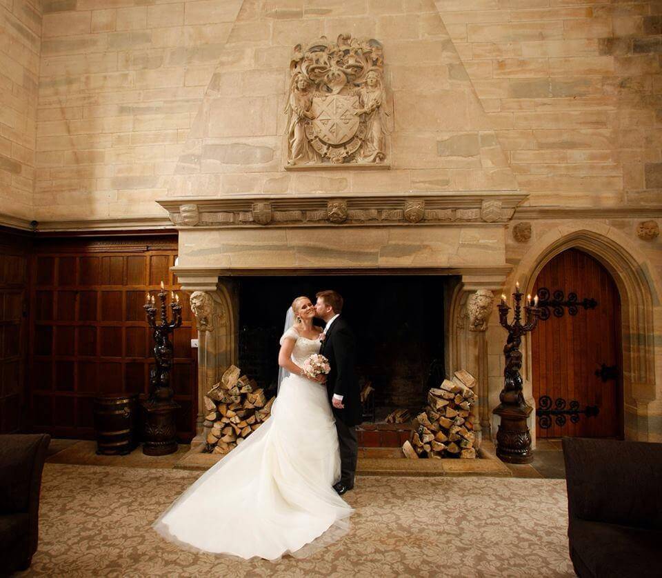 Chelsey infront of fireplace