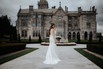 Waterlily Wedding Planners, bride standing outside of an estate